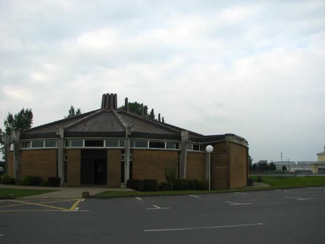 Askea Church, is a fine modern building with a copper roof and impressive space inside.