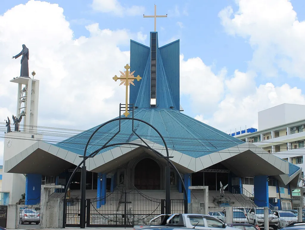Sacred Heart Cathedral in Sibu with statue of Jesus Christ and two angels.