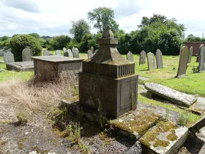 Pedestal cenotaph to Thomas Cawley and others by chancel door of Church of St Peter