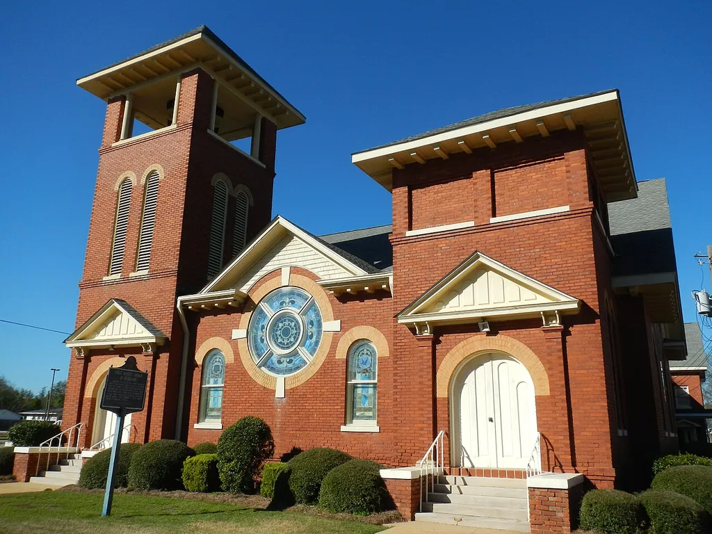 This is a photograph of the First Baptist Church of Headland, Alabama. Organized in 1867 as the Baptist Church of Christ at Bethlehem, it was located at 1 Cleveland Street. Rev. Thomas Scott was first pastor. William Whitehead was first deacon. Moved to East Church and Peachtree Street in 1893. Moved to present site in 1909. Name changed to Headland Missionary Baptist Church. Name changed to First Baptist Church of Headland in 1954.