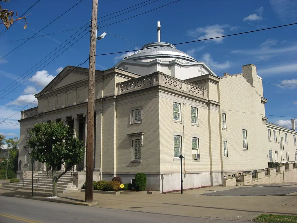 Southern side and front of the Holy Trinity Greek Orthodox Church, located at 300 S. Fourth Street in Steubenville, Ohio, United States. Built in 1914 and formerly a Methodist church, it is listed on the National Register of Historic Places.