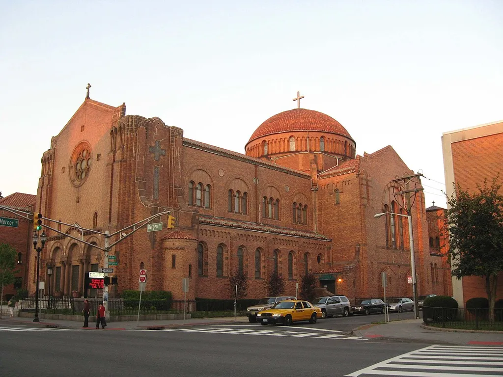 Looking northeast across Mercer Street and Bergen Avenue at St Aedan's RC Church south of Bergen Square in en:Jersey City, New Jersey near dusk