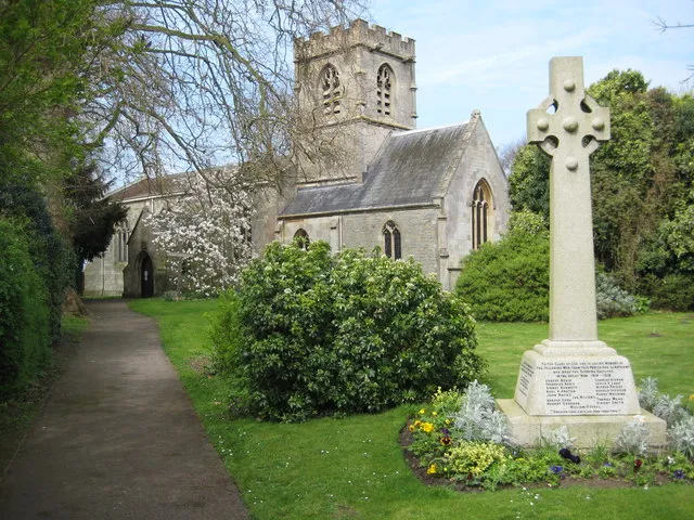 St Swithun's parish church and war memorial, Hempsted, Gloucester, seen from the southeast