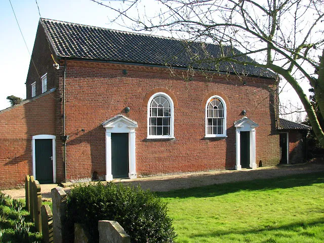 Neatishead Baptist Church. The church was founded in 1811 and is now a Grade 2 listed building; a two storey extension that incorporates an addition to the sanctuary and living accommodation - presumably the pastor, and later the caretaker lived there - was added in 1857. William Cubitt (died 1872) and his wife Martha were two of the founder members; another family member, William Quincy Cubitt (of Ivy Farm, Neatishead) is recorded as being a generous supporter of this chapel. Originally, the churchyard was located at the front of the church but was later extended to the back, where burials still take place. Alongside the church were the stables, still containing the original tethering rings. The building also houses two Sunday School rooms and there is an outside toilet. The manse and a caretaker's cottage (both sold), and land at both ends of the site, completed the complex. See also > 691681