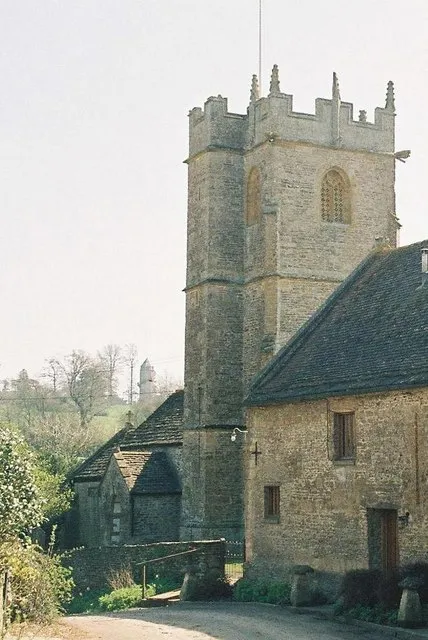 15th-century tower of St Martin's parish church, Lillington, Dorset, with part of the Tythe Barn in the foreground