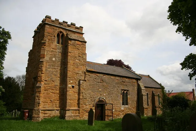 St.Mary's church, Hatcliffe, Lincs. Sturdy ironstone tower of c1300, the south door is late 12th century and a restoration of 1861-2