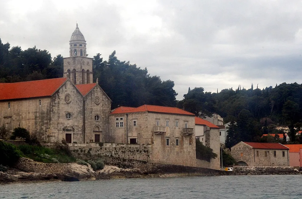 OLDER PORTION OF THE CHURCH WAS BUILT IN 1505 AND THE NEWER PORTION IN 1685. TAKEN FROM A TENDER RETURNING TO THE SHIP. CHURCH IS LOCATED OUTSIDE THE MAIN WALLS OF KORCULA
