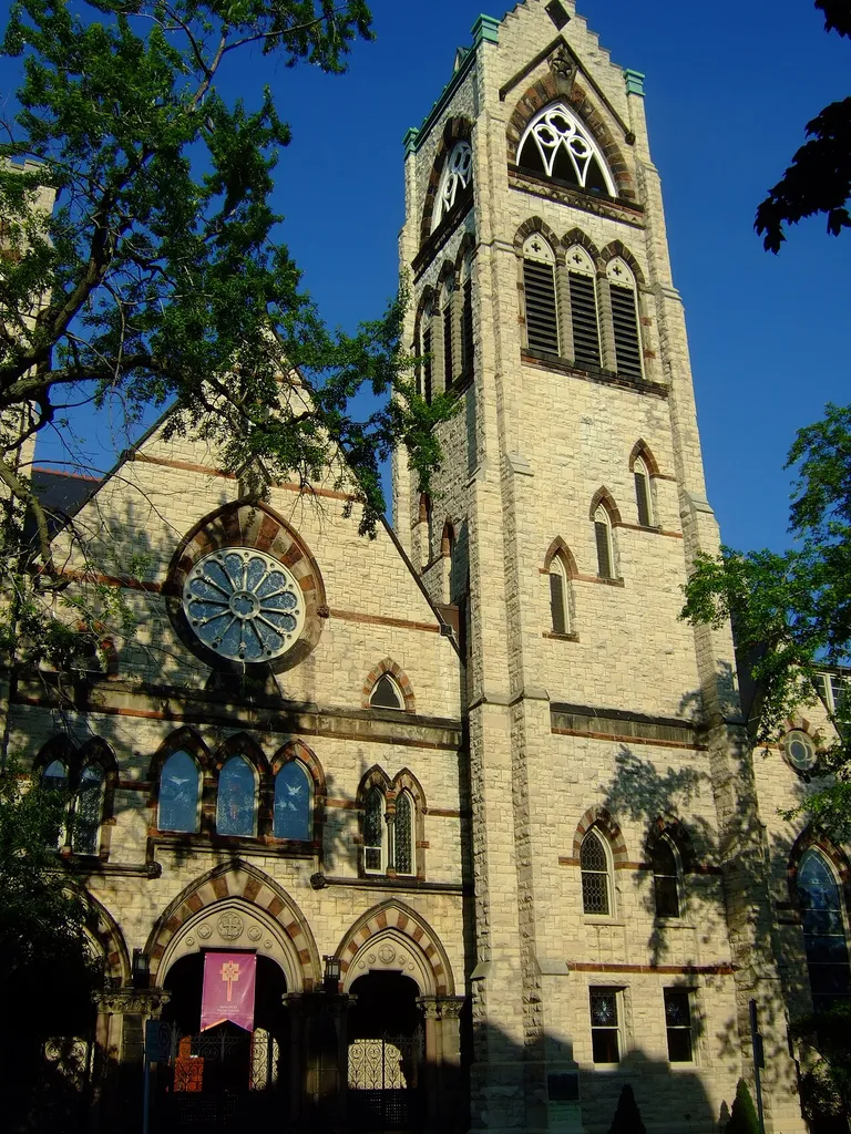 Immanuel Presbyterian Church in Milwaukee, Wisconsin. Designed by E. Townsend Mix in Gothic Revival style and built at a cost of $200,000 in the wealthy Yankee Hill neighborhood in 1873, the church is located just one block away from another church designed by Mix, All Saints Episcopal, which was originally built as Olivet Congregational Church. Both edifices are now listed on the National Register of Historic Places. Built of buff-colored Wauwatosa limestone enlivened by red and gray limestone interjections typical of the Victorian era's pleasure in polychrome ornamentation, Immanuel Presbyterian also had a colorful interior designed by Peter B. Wright that was destroyed in an 1887 fire.