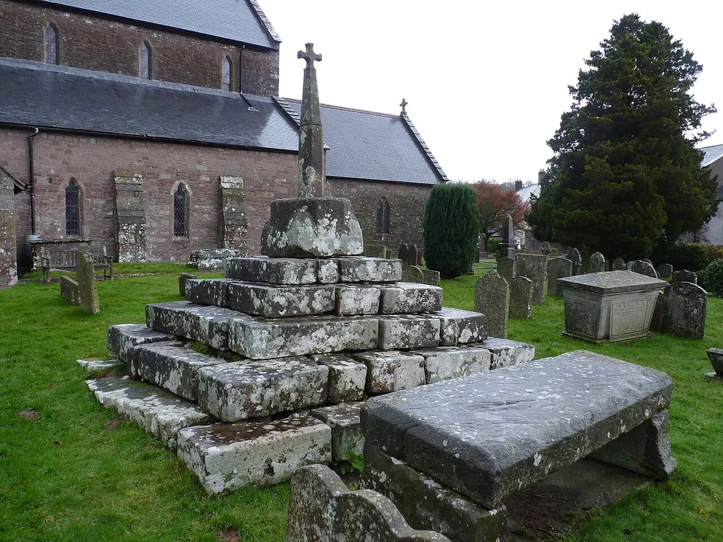 Stone preaching cross on a large base and six-stepped pedestal, in the Churchyard of St. Nicholas Church, Trellech, Monmouthshire, on the west bank of the River Wye.