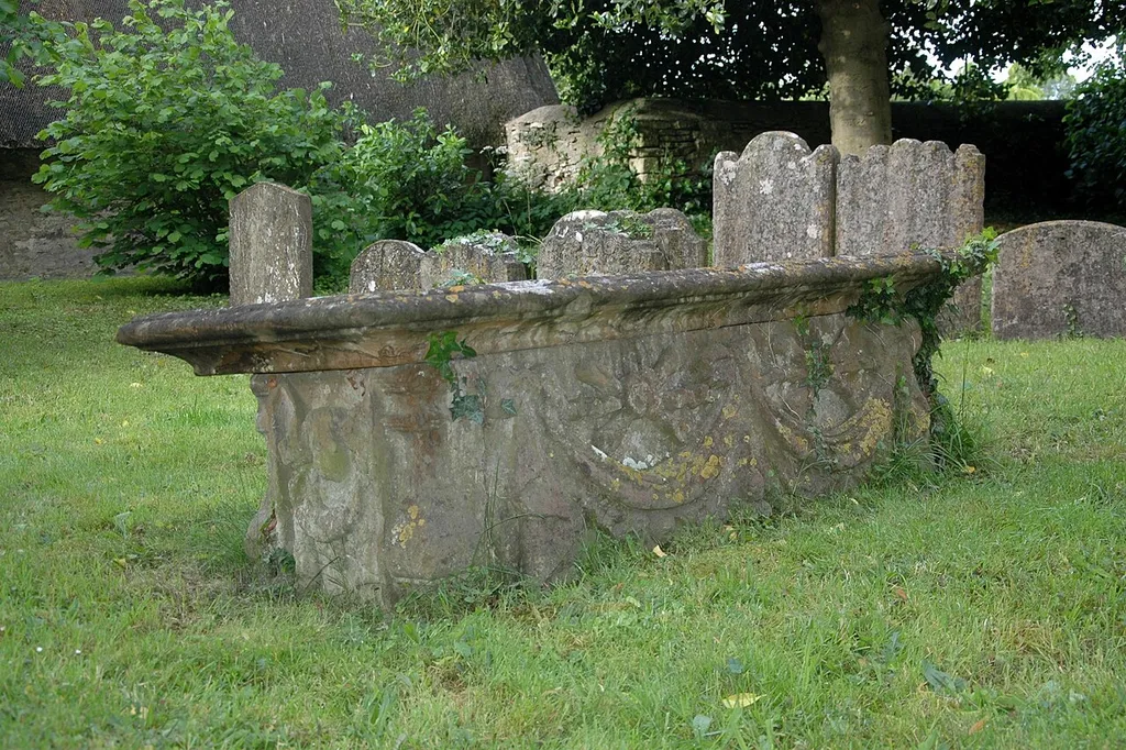 Late 17th-century chest tomb with baroque decoration in St Nicholas the Confessor parish churchyard, Islip, Oxfordshire