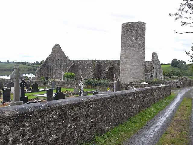 The round tower, Drumlane Abbey A monastery was founded here in the 6th century, either by St Colmcille or St Maodhog. The main building to survive from this period is the round tower, of which the lower part dates from the 10th or 11th century. In the mid-12th century, the Abbey was re-founded by the Augustinians and the upper section of the tower was added possibly in the 15th century. Most of what survives of the Church dates from the 15th and 17th centuries.