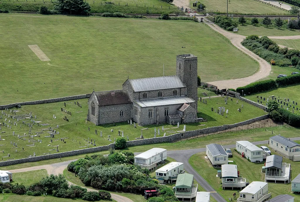 on the north Norfolk coast. Partly 11th Century.