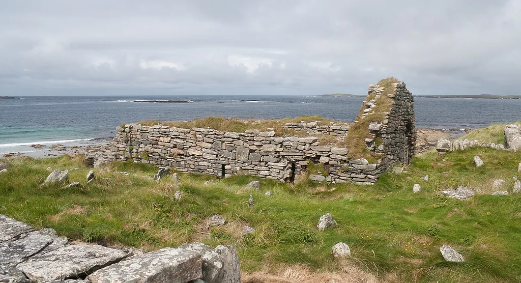 South-east view of the church of Cross Priory with Annagh Head in the background.