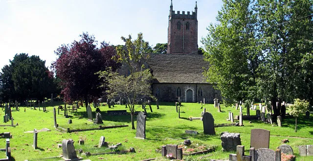 St Briavels churchyard. North of the church. A footpath runs left to right across the churchyard to a gate on the Mork Road. See 520093
