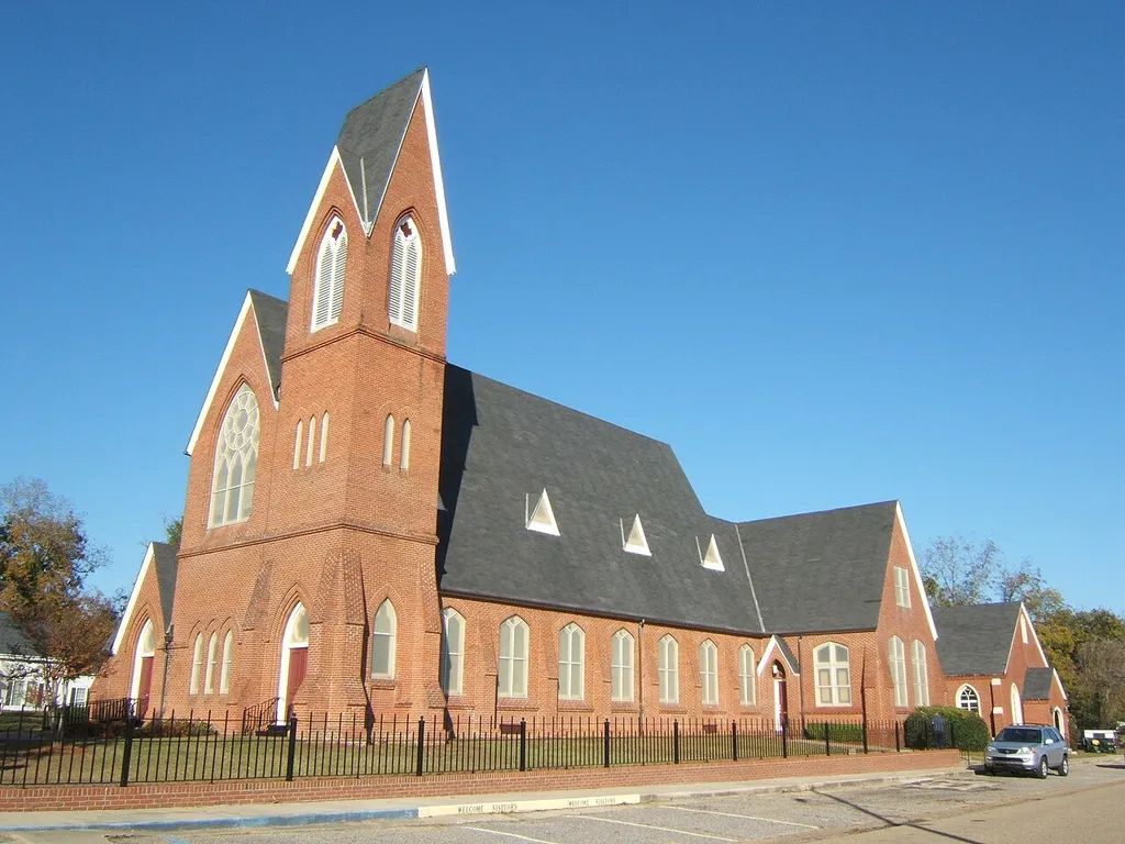 First Presbyterian Church in Eufaula, Alabama. Built in the High Victorian Gothic style in 1869, it originally had a polychromatic roof and ornate metal cresting along the roof ridges.