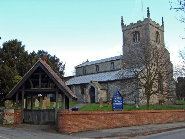 Church of All Saints, North Collingham. Although this church, dating from the 11th century, is regarded as the main parish church for the village of Collingham, North and South Collingham used to be separate parishes each with their own church. Even though it stands on the aptly named Low Street, the church is on a slight rise and has escaped the floods from the River Fleet during the last centuries. The depth of an 18th century flood is carved into the gate post at the western end of the churchyard.