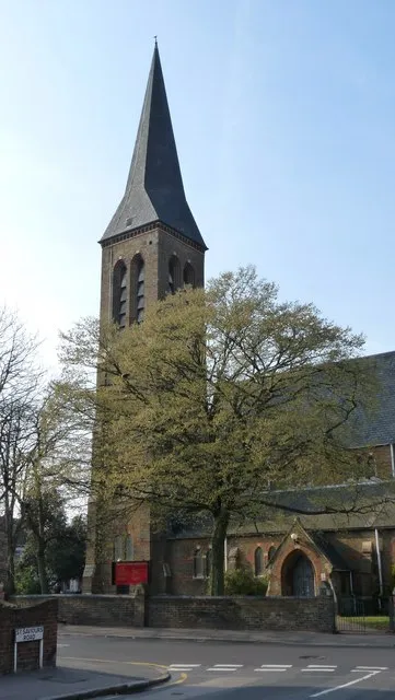 South-west tower, broach spire and south porch of Holy Saviour parish church, St Saviour's Road, Croydon, Greater London, seen from the east