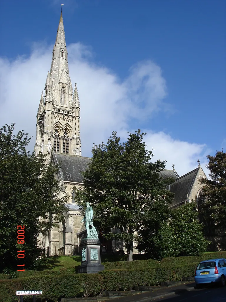 All Saints church, Halifax, designed by Sir Gilbert Scott for Edward Ackroyd, whose statue stands in the foreground.