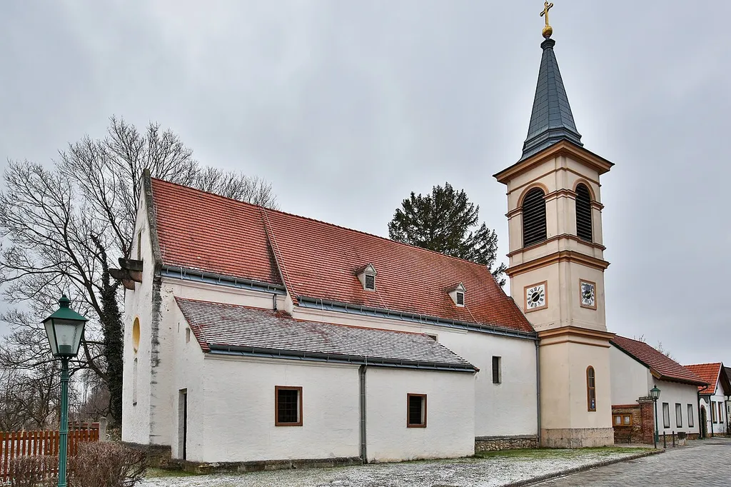Filial church Winzendorf in Winzendorf am Steinfeld, municipality Winzendorf-Muthmannsdorf, district Wiener Neustadt-Land District, Lower Austria / Austria / EU. Morning atmosphere, overnight it has snowed a little.