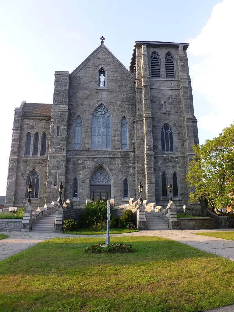 Immaculate Conception Church, a Roman Catholic Church located at 144 East Merrimack Street, Lowell, Massachusetts. South (front) side of building shown, as viewed from East Merrimack Street.