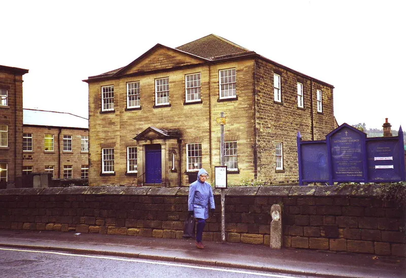 Belper Central Methodist Church, Derbyshire The paint scheme has now been turned into a rather dull brown, but the blue sign and door add a splash of colour, along with the woman in the raincoat, on a very rainy Midlands day.