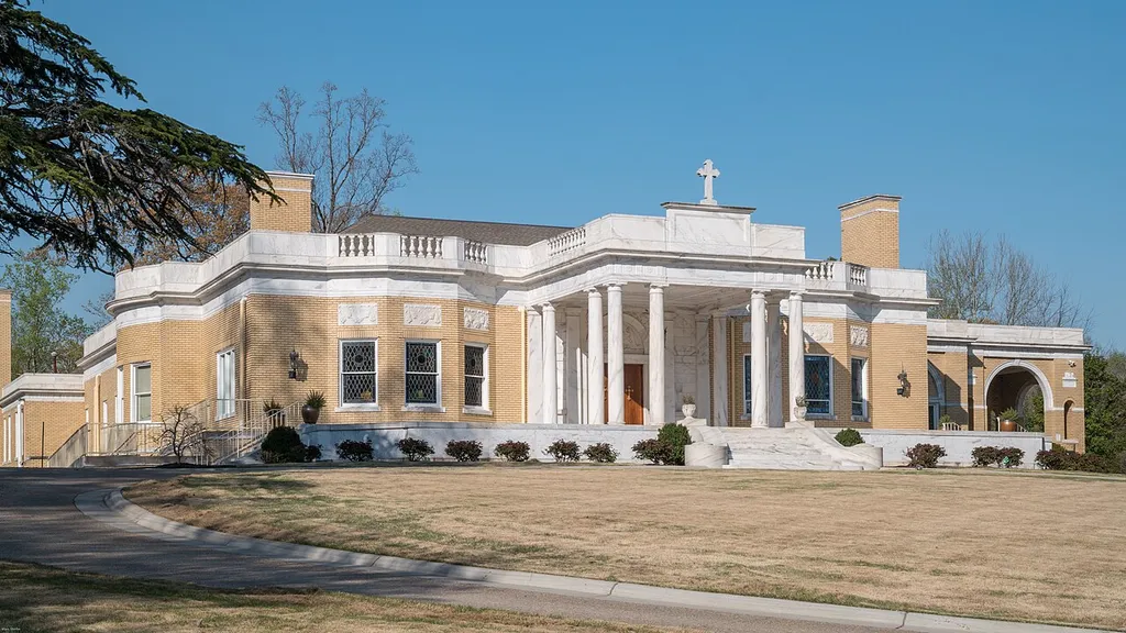 St. John Chrysostom Melkite Catholic Church on Ponce de Leon Avenue in Atlanta, seen here, did not begin as a church. Before its "present and holy utilization," as described on the church's website, the building was the home of Coca-Cola magnate Asa Griggs Candler. Built in 1916 at a cost of $210,000, it remained in the Candler family long after his death in 1929. After years of being rented out and used as boarding home, the structure was bought in 1946 by the American Legion with the intention of using it for their state headquarter, a plan which did not materialize. Atlanta's small Melkite Catholic Community purchased the former Candler mansion in 1957 for $62,000. It took more than $250,000, though, "to transform it, as much as possible, into the beginning of a proper Byzantine house of worship."