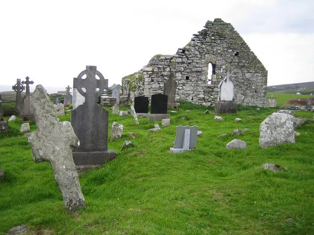 Kilcatherine Church This ancient monastic site and ruined medieval church date from the 7th century. The church is named after the mysterious St. Caithighearn, reputedly known as "The Cat Goddess", and has a curious stone head that looks like a cat set above the door archway in the southern facade. The leaning stone on the left is one of the earliest stone crosses in Ireland.