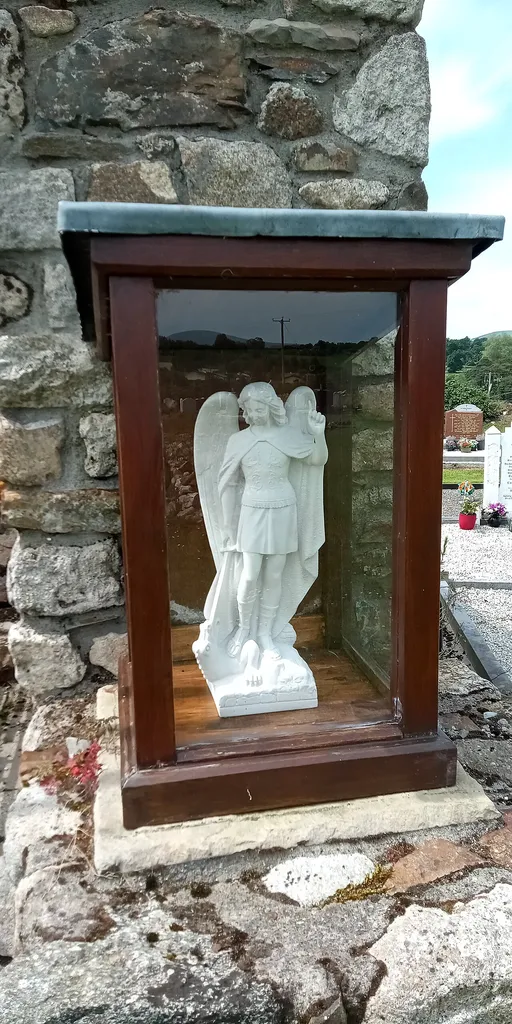 statuette of Saint Michael at Saint Michael's Church (church ruin in Tinnahinch, Co. Carlow)