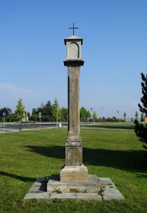 Plague column close to the Church of Assumption of Virgin Mary in Most