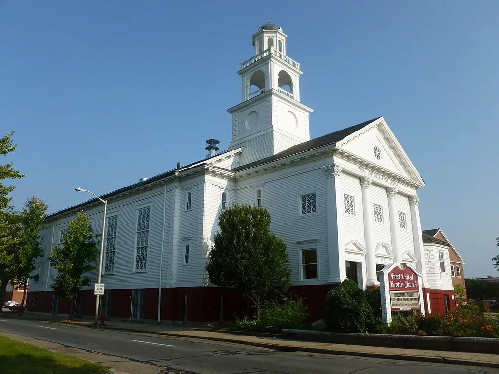 First United Baptist Church, located at 99 Church Street, Lowell, Massachusetts. North and east (front) sides of building shown.
