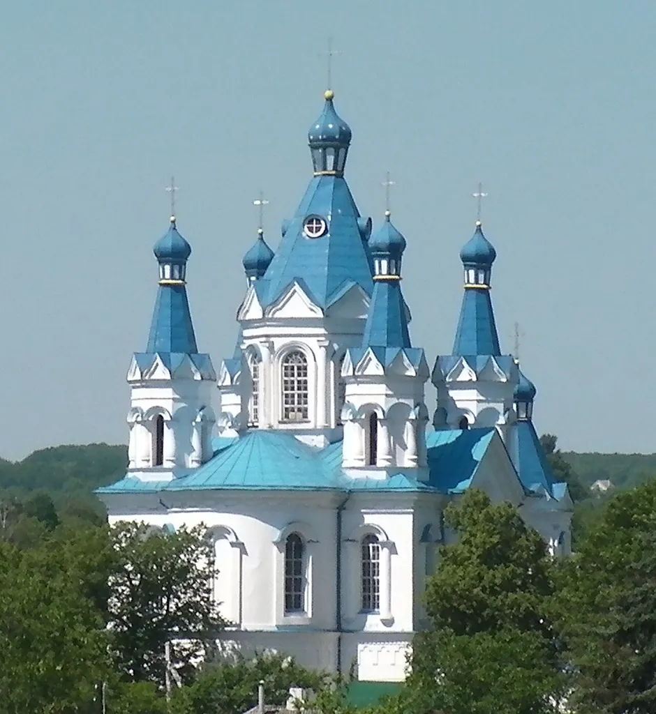 View west (camera zoomed) of a blue church from near St-Peter-and-Paul church in the old town of Kamianets-Podilskyi (Кам'янець-Подільський), Ukraine