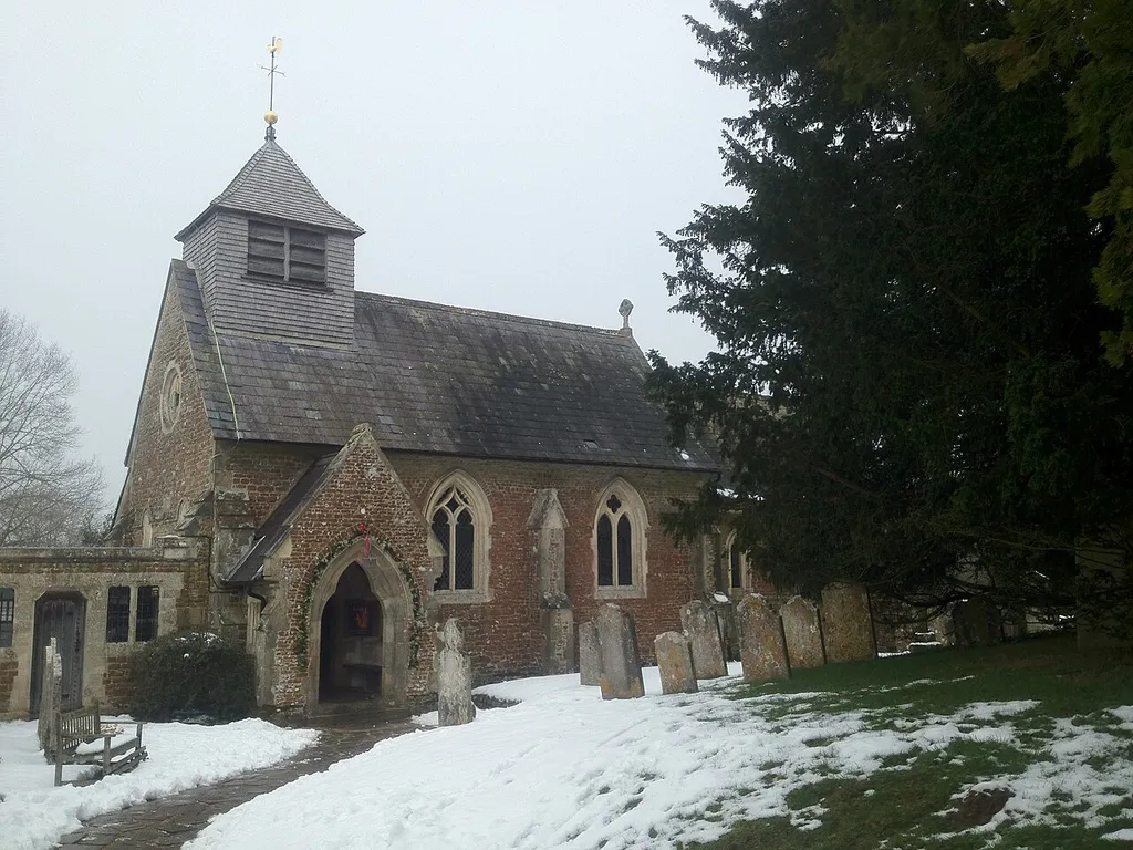 St Peter's parish church, Hambledon, Surrey, seen from the southwest in snow