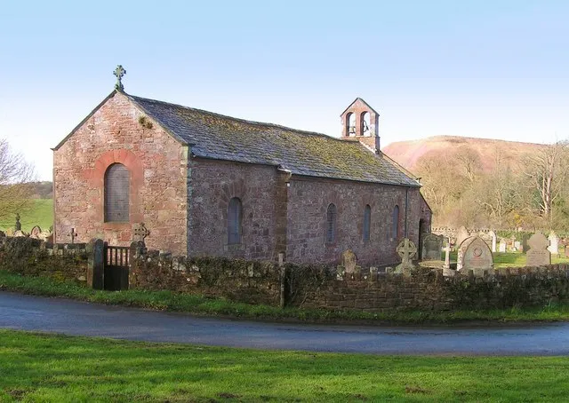 Haile parish church, Cumbria, seen from the northeast. A largely 18th-century building, heavily restored in 1883. The spoil heap in the background is from the disused Beckermet Iron ore mine.