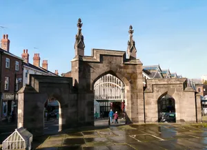 Gateway to Parish Church of St Mary and fountain to side