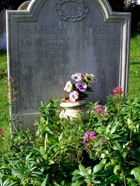 Remembering James Hammett - A Tolpuddle Martyr James Hammett was one of the six Tolpuddle Martyrs, and the only one who returned to the village. Above the inscription is the date 1834, the year of the Martyrs conviction for the swearing of illegal oaths. The inscription reads: 'James Hammett Tolpuddle Martyr, Pioneer of Trades Unionism, Champion of Freedom. Born 11 December 1811, Died 21 November 1891.'