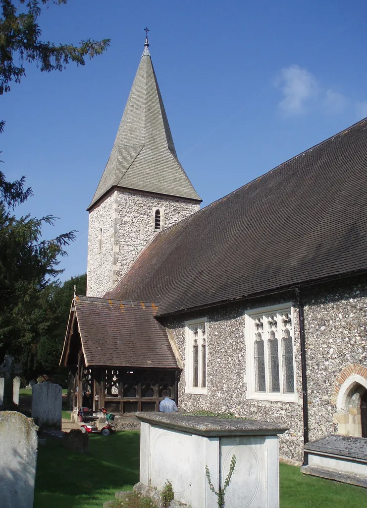 West tower, broach spire and south porch of SS Peter and Andrew's parish church, Old Windsor, Berkshire, seen from the southeast