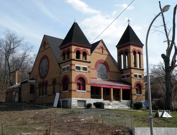 Picture of John Wesley A.M.E. Zion Church located at 594 Herron Avenue in the Upper Hill neighborhood of Pittsburgh, Pennsylvania, on March 20, 2010. The church was founded in 1836, and is an historic African American church. The church building in the picture was originally the First Presbyterian Church of Minersville, built in 1894 by John Herron and family. The property was purchased in 1947 by the John Wesley Board of Trustees and made home to an African-American congregation with roots in the pre-Civil War era. The church is on the List of City of Pittsburgh historic designations. In 1994, the congregation was forced to temporarily abandon the church property following flooding that was created by waters from an abandoned 100-acre mine that ran below the church. In 2006, the church again faced flooding from the mine water, and the Pennsylvania Department of Environmental Protection (DEP) installed new piping to divert the mine water from the church. At the DEP's suggestion, a geothermal system was installed in November 2008 that used the runoff from the mine water to provide heating and cooling for the church building.