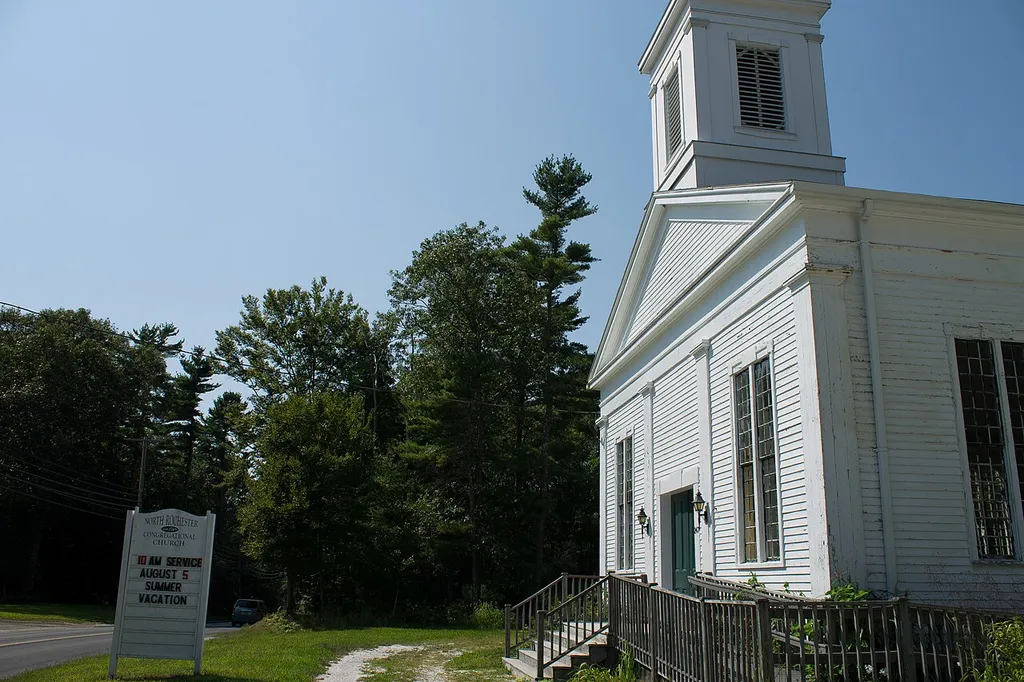 North Rochester Congregational Church A landscape picture of the church and its accompanying sign.