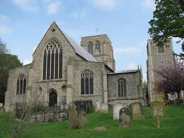 St Nicholas' parish church, East Dereham, Norfolk, seen from the west. On the left in the foreground is St Withburga's well. On the right in the background is the detached bell tower.