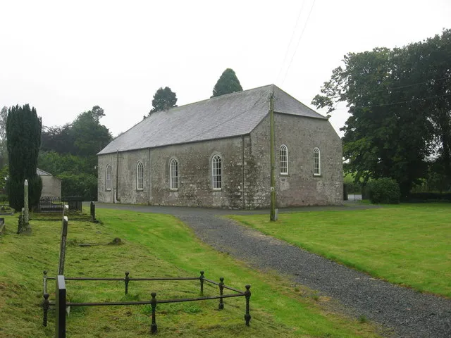 First Presbyterian Church, Ballybay, Co. Monaghan, near to Edenancane, Corfad, Balladian, Creevagh and Ballybay, Monaghan, Ireland. On the Ballybay to Clones road in the townland of Derryvally. Date stones over the door on the far gable and on the near gable, where it looks like there may also have been a door, are inscribed '1786'.