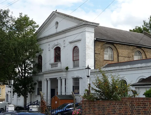 Former Congregational Chapel, Chapel Road This handsome mid-19th century building has a stucco front with a pediment containing an oculus, a porch of paired Ionic columns in antis, and lower wings. Grade II listed. It is now used as a children's nursery.