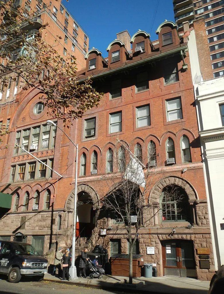 Looking north across 74th Street on a sunny midday.