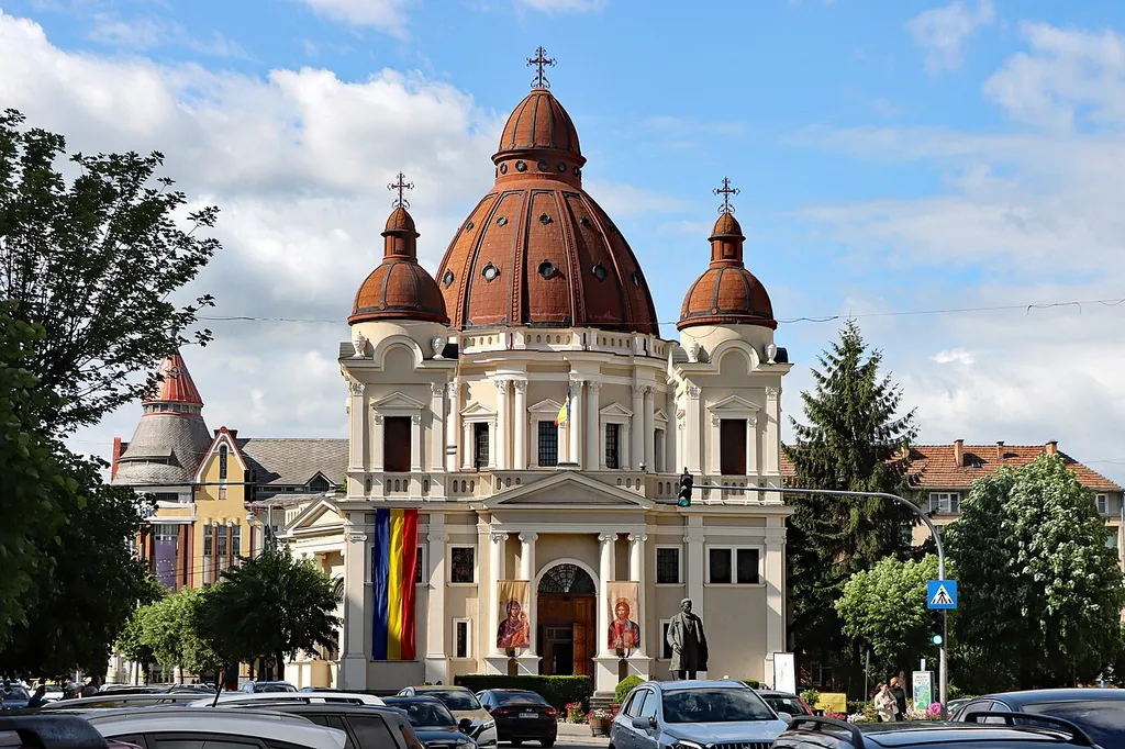 The Annunciation Church, known by locals as the small Cathedral (for the distinction of the Orthodox Cathedral on the opposite side of Market Rose) was built between 1926-1936 according to the model's Basilica St. Peter's in Rome. The church was sanctified on 8 September 1936 by the Greek-Catholic metropolitan Alexandru Nicolescu of the Archbishop of Fagaras and Alba Iulia. In 1948, after the prohibition of the Romanian Church United with Rome, the Communist authorities installed in the Church a parish of the Romanian Orthodox Church.