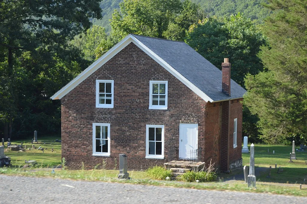Front and eastern side of the Oakland Grove Presbyterian Church, located on Selma Low Moor Road west of Clifton Forge in Alleghany County, Virginia, United States. Built in 1847, it is listed on the National Register of Historic Places.