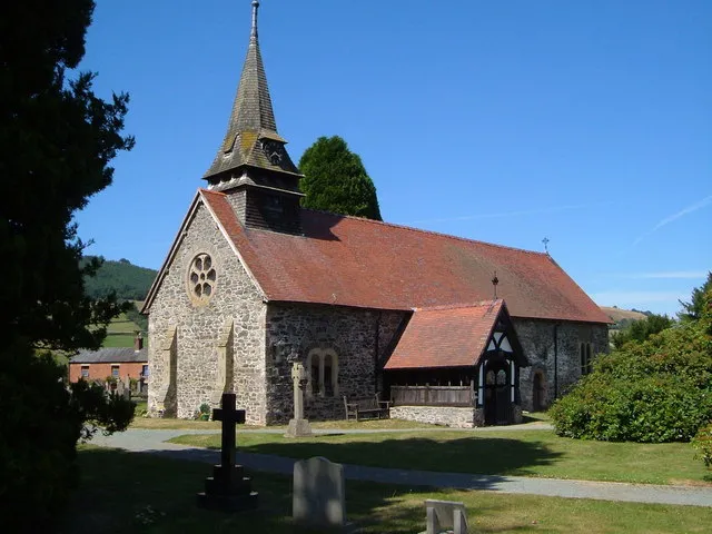 Church of St Garmon , Llanfechain http://www.cpat.demon.co.uk/projects/longer/churches/montgom/16408.htm. There should be a golden cockerel weathervane but it's out of shot!