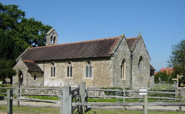 SS Peter and Paul parish church, Ashington, West Sussex, seen from the southeast. The nave is 15th-century; the south aisle was added in 1872. One of the bells was cast in 1350.
