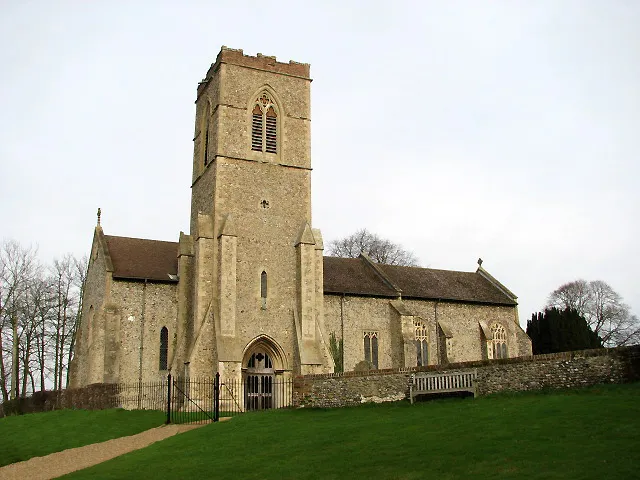 St George's Church. St George's church is located about 2 kilometres northwest of Hardingham, a village consisting of scattered hamlets and groups of houses. Like a number of other churches in this area, St George has its tower not at the west end but at the south wall > 668600. The interior was extensively restored during Victorian times > 846796 - 846827 - a piscina, the George III royal arms and a C13 font > 846833 - albeit broken - have survived. A few interesting C17 ledger stones > 846822 - 846825 can be found on the chancel floor; the west end of the nave has been devoted to villagers lost during WW1. The stained glass windows date from the 19th and early 20th centuries > 846810. A window in the west wall commemorates Major William Mordaunt Marsh Edwards VC who won the Victoria Cross at Tel-el-Kebir during the Egyptian war of 1882 > 846838. A memorial window to William Bartle Marsh Edwards of the Rifle Brigade, killed in action in Tunisia, 1943, is in the north wall > 846817. The church is kept locked but a key is available at the adjoining Old Rectory > 668609. For more information see: http://www.norfolkchurches.co.uk/hardingham/hardingham.htm