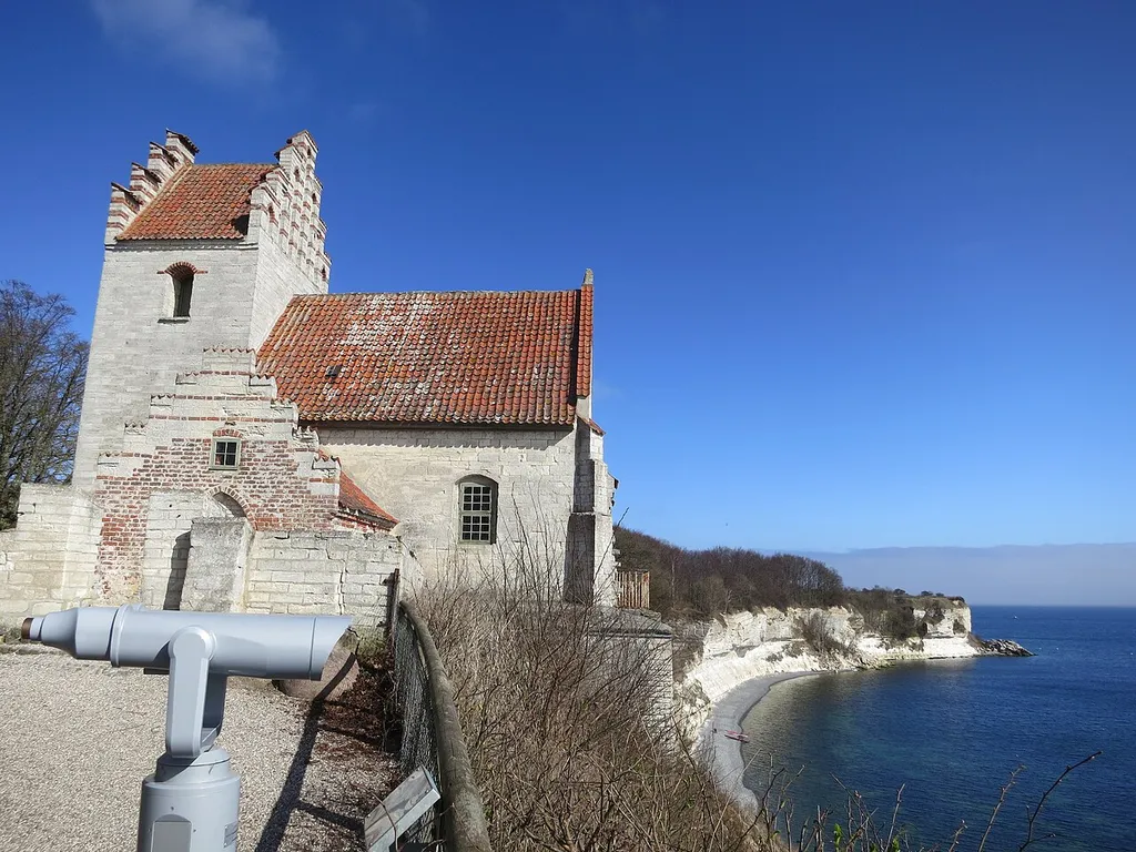Højerup Old Church is a medieval church that was undermined by the extraction of lime from the cliff. The choir partially fell into the sea in 1928.