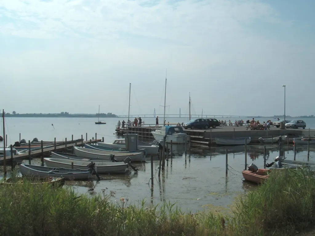 Skåningebro. Bathing jetty and small harbour on the north side of the island of Bogø, south eastern Denmark. In the background, the Farø bridge. Taken by contributor, July 2006.
