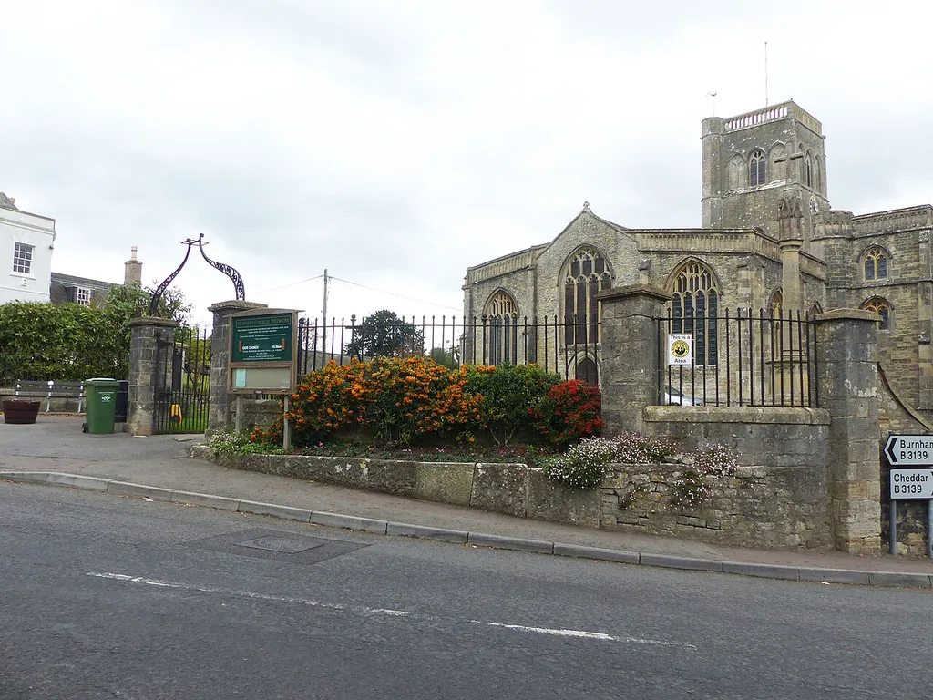 Grade II listed building in Wedmore, Somerset. Listed as "Railings, piers, gates and lamp overthrow at south west entrance to churchyard, Church Of St Mary". .mw-parser-output .messagebox{margin:4px 0;width:auto;border-collapse:collapse;border:2px solid var(--border-color-progressive,#6485d1);background-color:var(--background-color-neutral-subtle,#fbfcff);color:var(--color-base,#202122);box-sizing:border-box;border-inline-start-width:8px}.mw-parser-output .messagebox.mbox-small{font-size:88%;line-height:1.25em}.mw-parser-output .mbox-warning,.mw-parser-output .mbox-speedy{border:2px solid var(--border-color-error,#b22222);background:var(--background-color-error-subtle,#ffdbdb);border-inline-start-width:8px}.mw-parser-output .mbox-serious,.mw-parser-output .mbox-delete,.mw-parser-output .mbox-stop{border:2px solid var(--border-color-error,#b22222);border-inline-start-width:8px}.mw-parser-output .mbox-issue,.mw-parser-output .mbox-content{border:2px solid #f28500;background:var(--background-color-warning-subtle,#ffe);border-inline-start-width:8px}.mw-parser-output .mbox-query,.mw-parser-output .mbox-style{border:2px solid #f4c430;background:var(--background-color-warning-subtle,#ffe);border-inline-start-width:8px}.mw-parser-output .mbox-shit{border:2px solid #960;border-inline-start-width:8px}.mw-parser-output .mbox-license{border:2px solid #88a;border-inline-start-width:initial}.mw-parser-output .mbox-legal{border:2px solid var(--border-color-notice,#666);background:var(--background-color-base,#fff);border-inline-start-width:8px}.mw-parser-output .mbox-honor{border:2px solid #ca3;background:var(--background-color-warning-subtle,#fcf4db);border-inline-start-width:8px}.mw-parser-output .mbox-growth{border:2px solid #8d4;background:var(--background-color-success-subtle,#d5fdf4);border-inline-start-width:8px}.mw-parser-output .mbox-move{border:2px solid #93c;border-inline-start-width:8px}.mw-parser-output .mbox-protection,.mw-parser-output .mbox-message{border:2px solid 